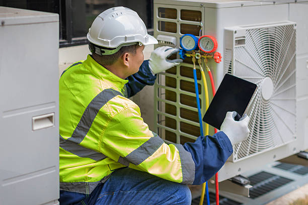 Professional Air Conditioning Repair technician working in Donahue, IA